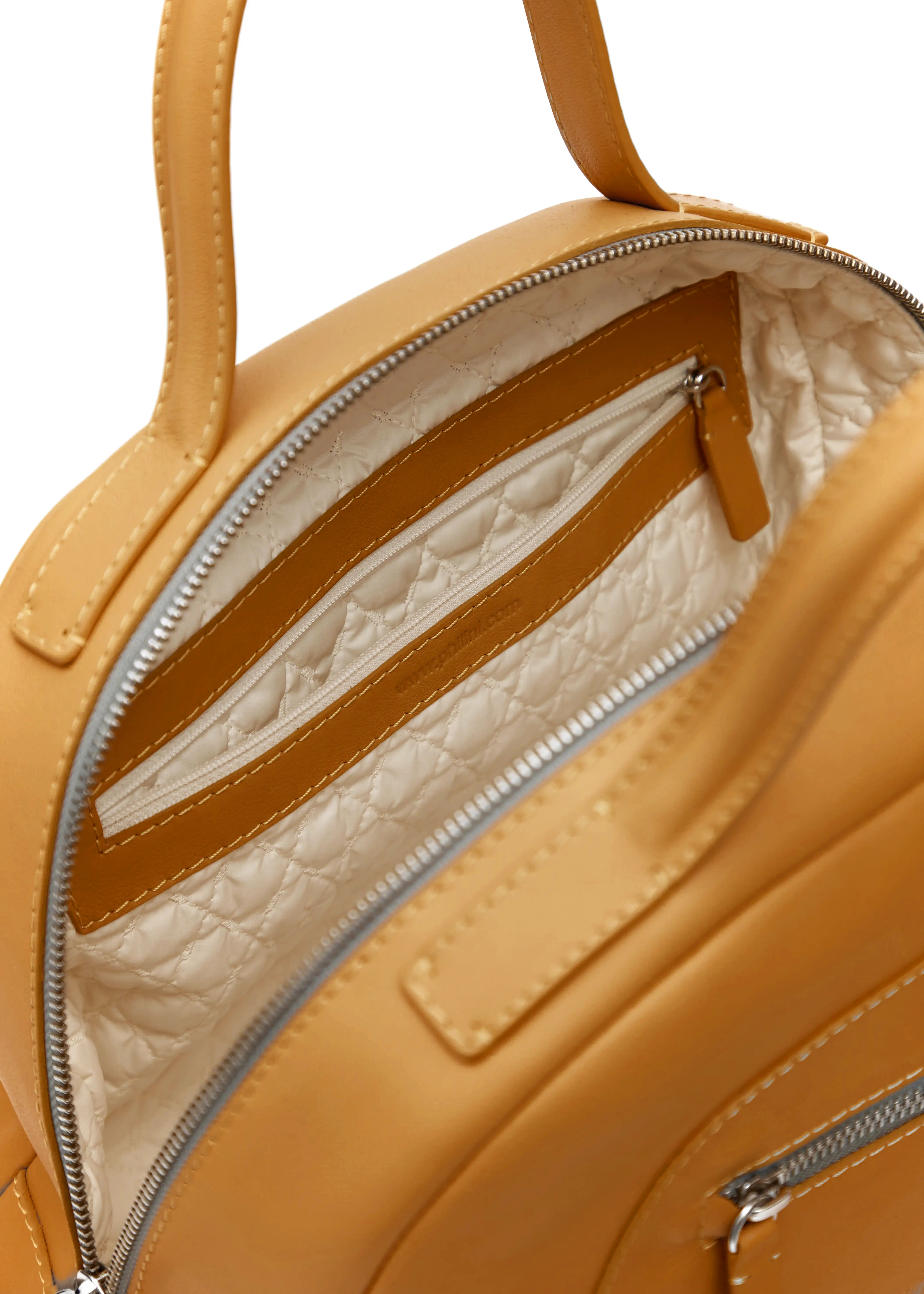 Inside view of the Philini Domi Handbag in yellow nappa leather, showing vanilla-patterned lining, two zip compartments, stamped plate, and hand-stitched details. Handcrafted luxury bag with elegant design and lasting style. 