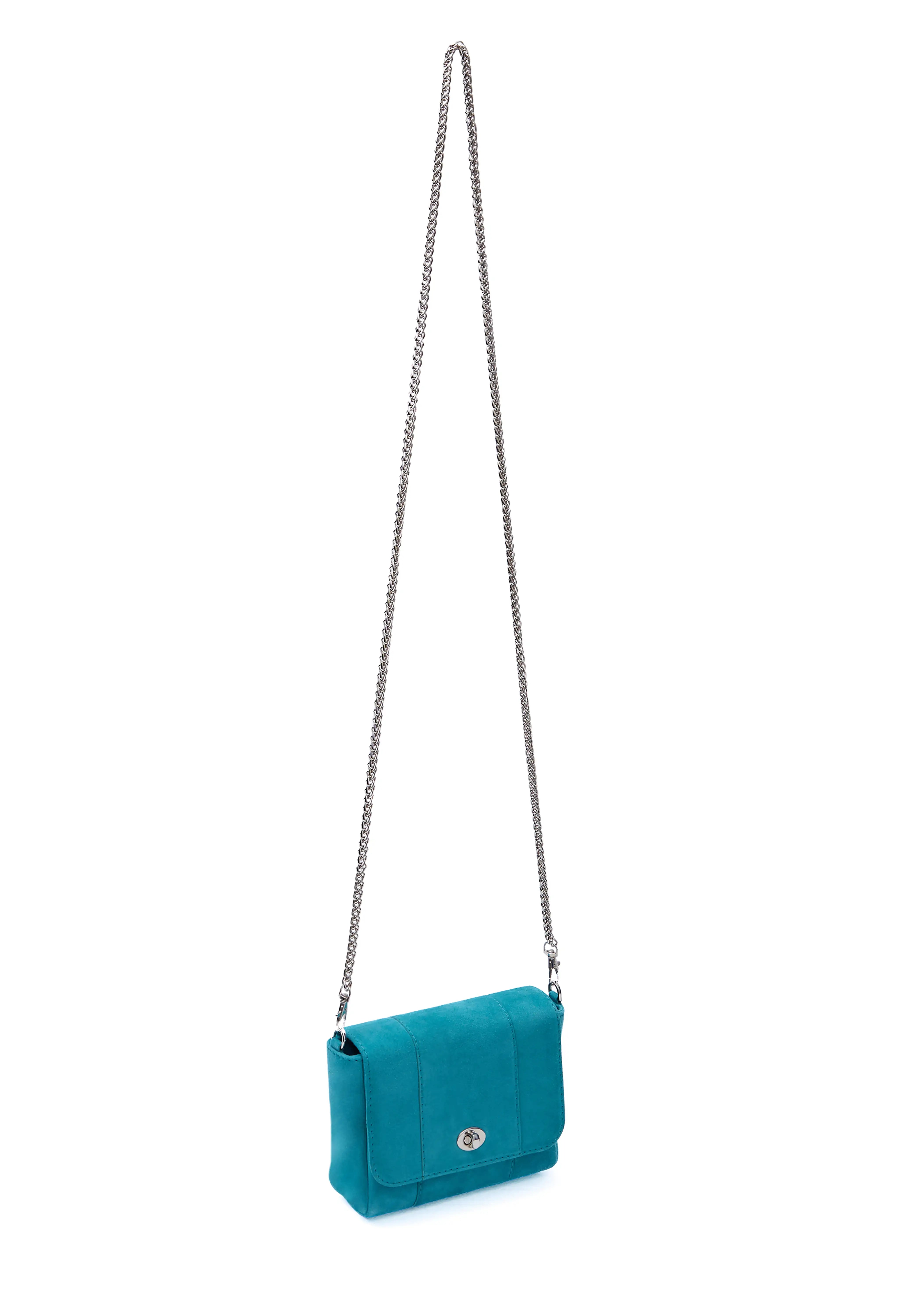 Side view of the Philini Marina Mini Crossbody Bag in turquoise suede leather, rectangular silhouette with front flap, silver clasp, and shoulder chain. Compact suede crossbody bag