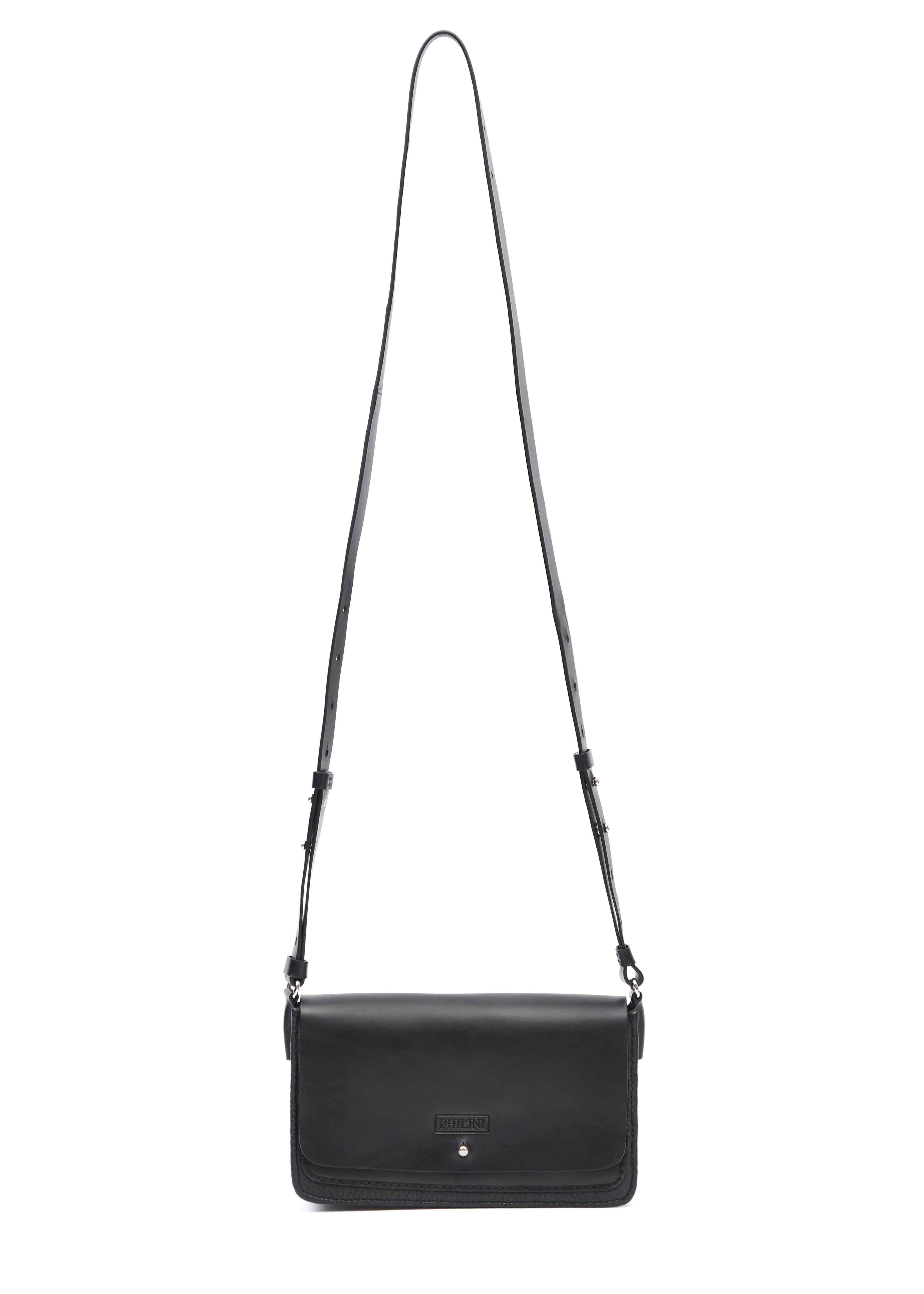Front view of the Philini Mihaela Black Wallet Bag, featuring a full-grain leather flap, buffalo leather base, silver cufflink closure, and an adjustable leather strap. A handcrafted, minimalist luxury handbag blending timeless design with sustainable materials