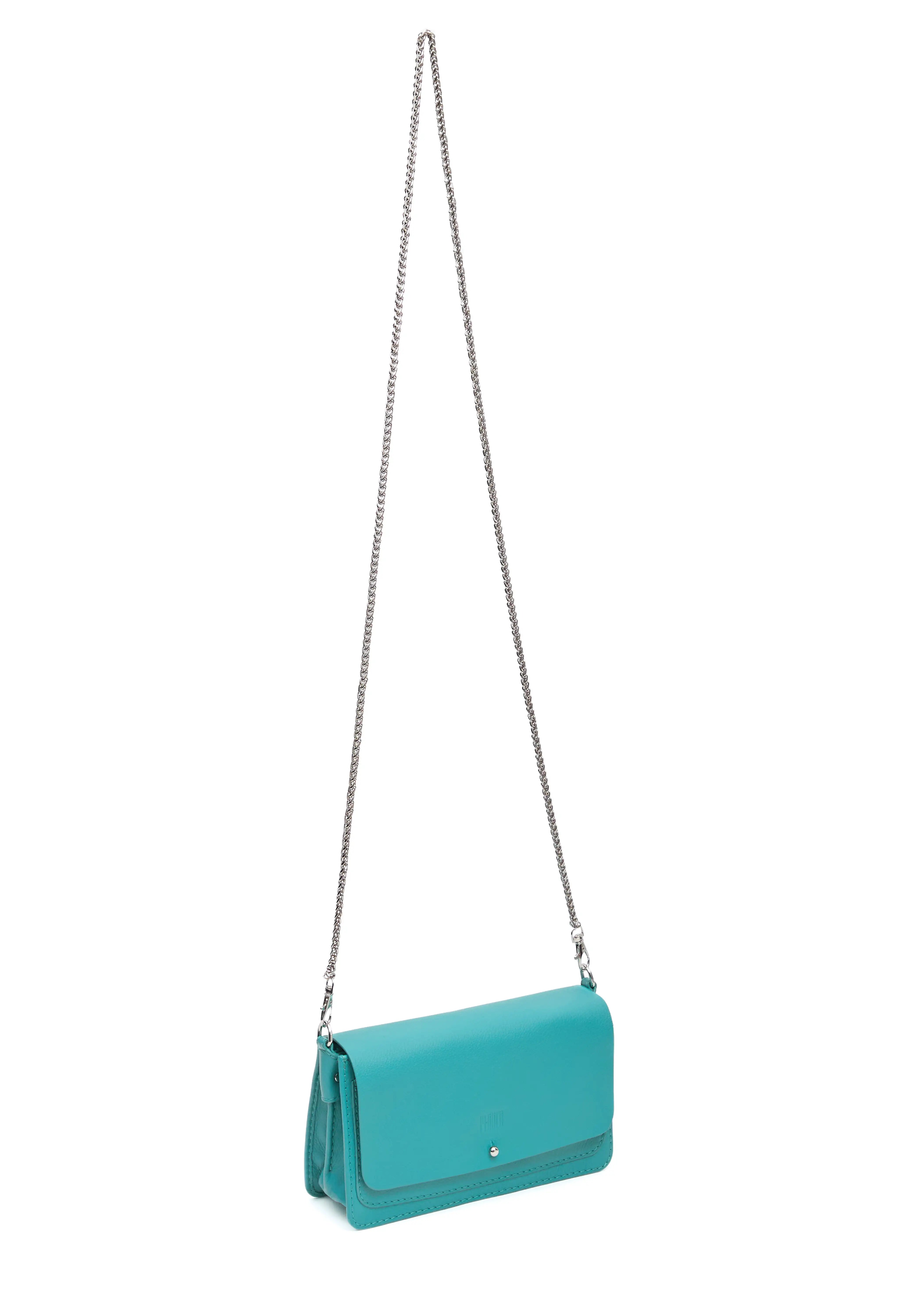 Side view of the turquoise Philini Mihaela Wallet Bag in nappa leather, featuring a tapered rectangular shape, accordion sides, silver cufflink flap closure, and a long silver chain handle, a compact handcrafted luxury wallet for minimalist and conscious style